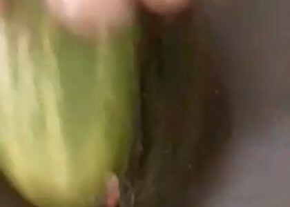 Rubbing Clit With Cucumber